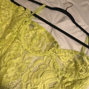 Bright yellow lace bodysuit